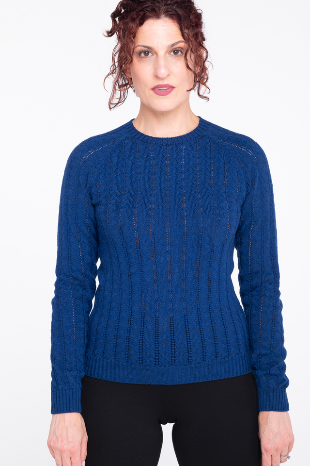 woman wearing cobalt blue pointelle sweater