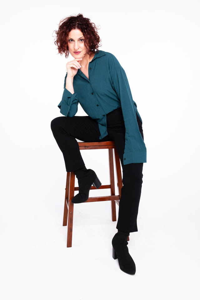 woman wearing cropped black Ponte pant with 3" inseam slit