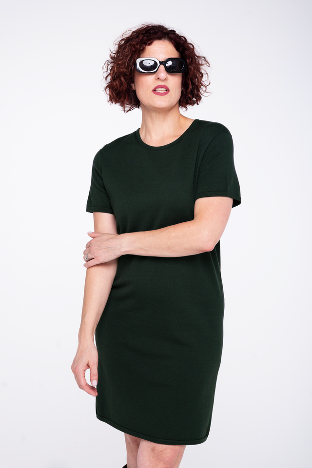 woman wearing a spruce green boxy knit t-shirt dress