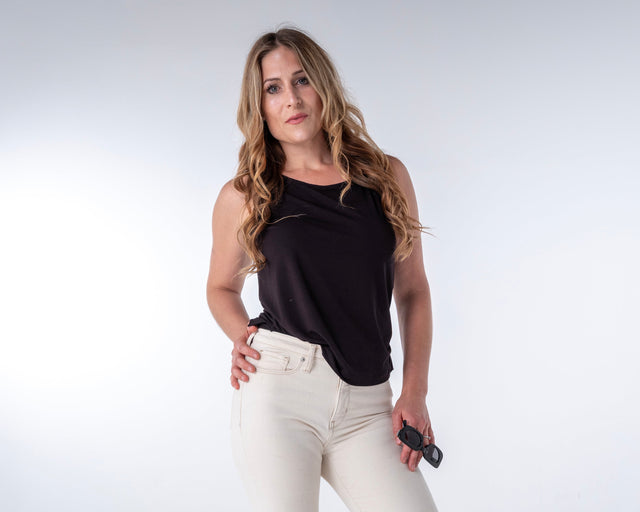 woman wearing a black bamboo tank top with side slit