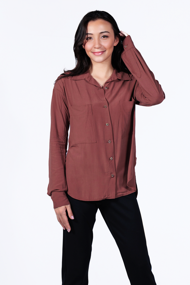 woman wearing a sustainable crepe  blouse in clay