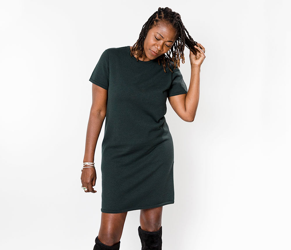 woman wearing emerald green sustainable knit dress