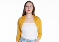 woman wearing a citrine yellow three-quarter sleeve bamboo shrug