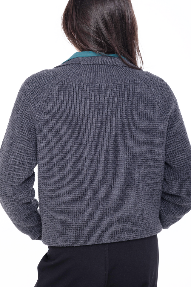 back detail of woman wearing grey merino wool 3/4 zip sweater