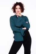 woman wearing a sustainable crepe blouse in teal
