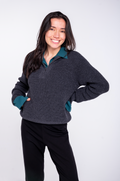 woman wearing grey merino wool 3/4 zip sweater