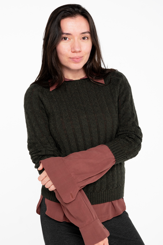 woman wearing olive pointelle sweater