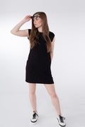 woman wearing a belted black raglan cap sleeve bamboo knee length dress