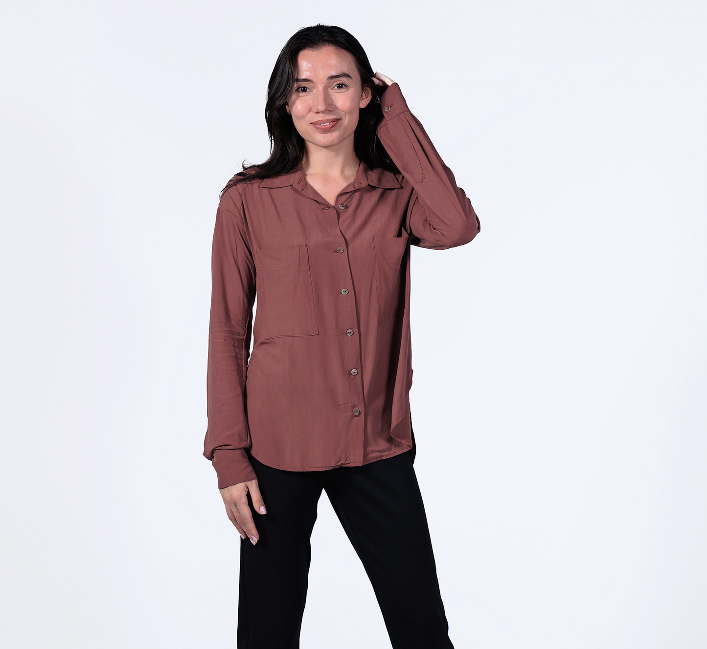 woman wearing a sustainable crepe boyfriend shirt in brick