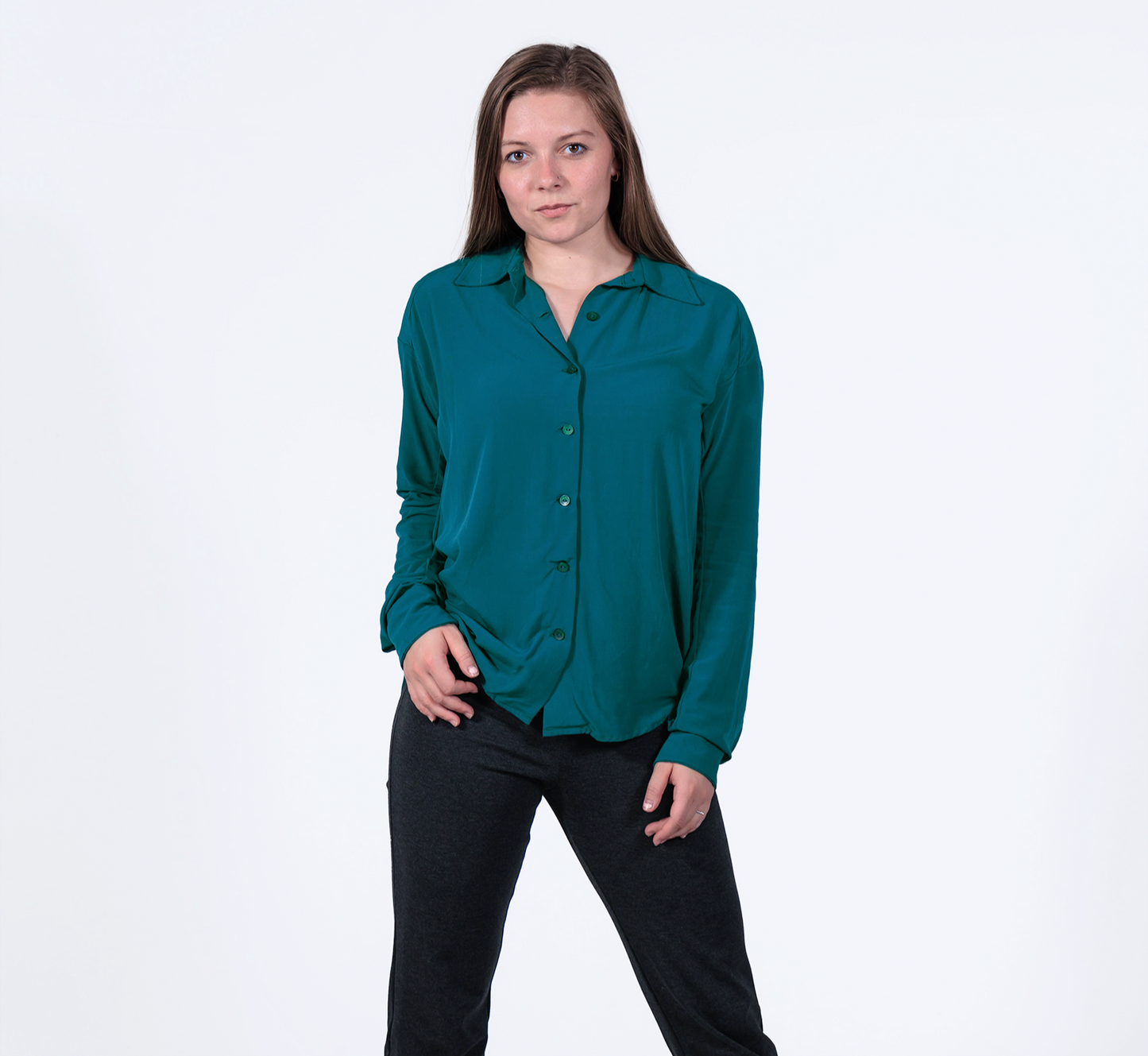 woman wearing a sustainable crepe boyfriend shirt in teal