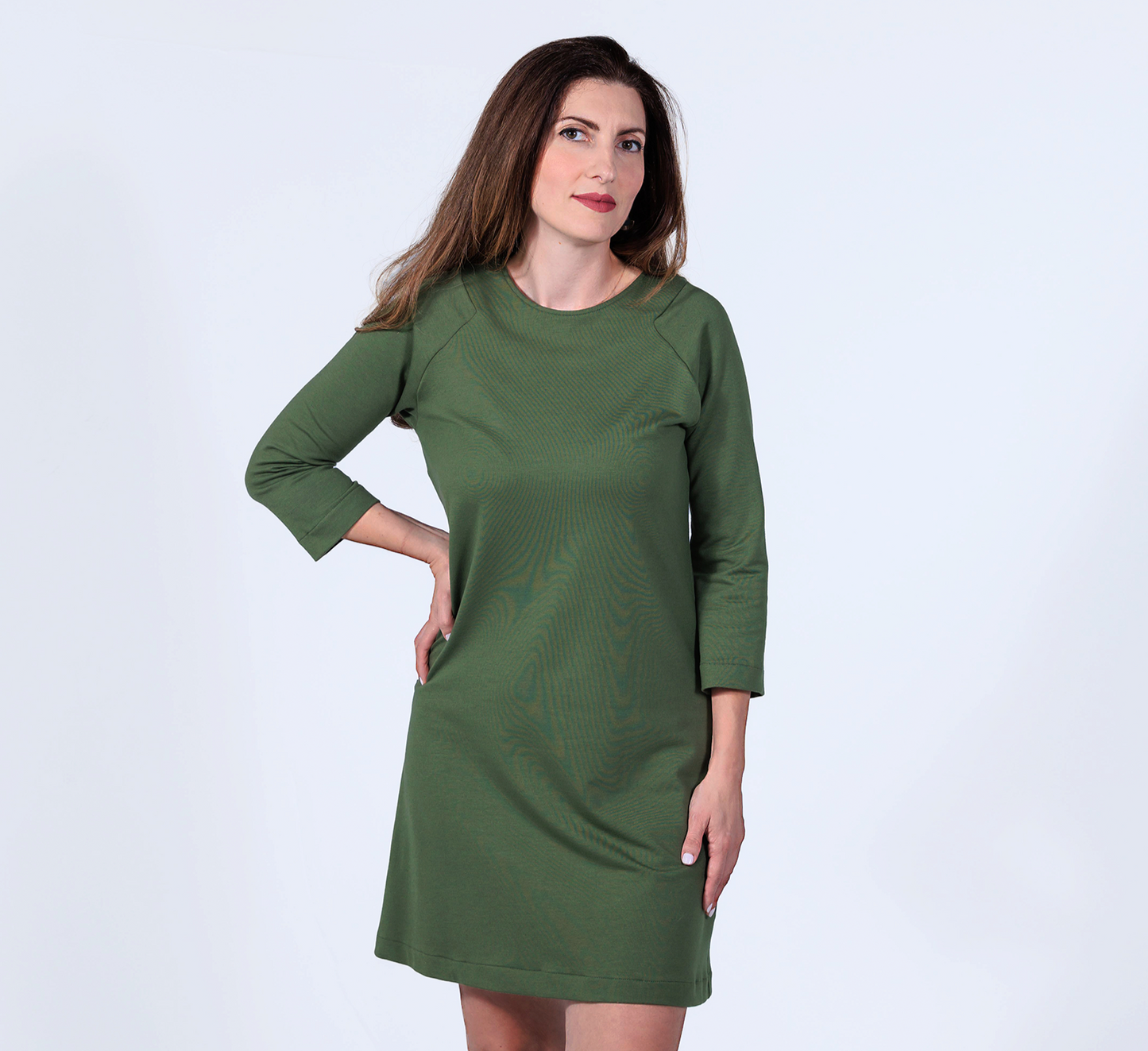 woman wearing a fern green french terry raglan dress