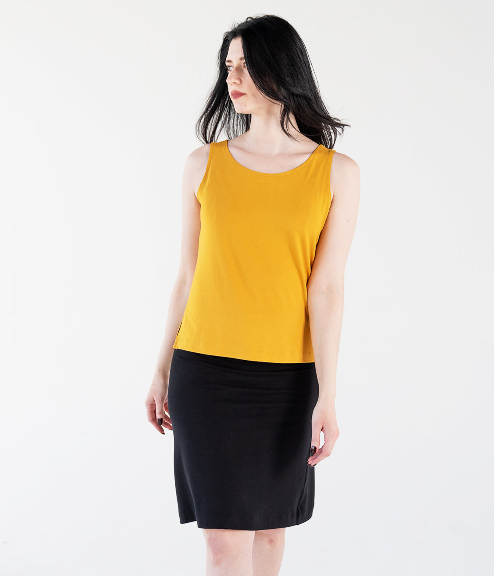 woman wearing a citrine colored bamboo tank